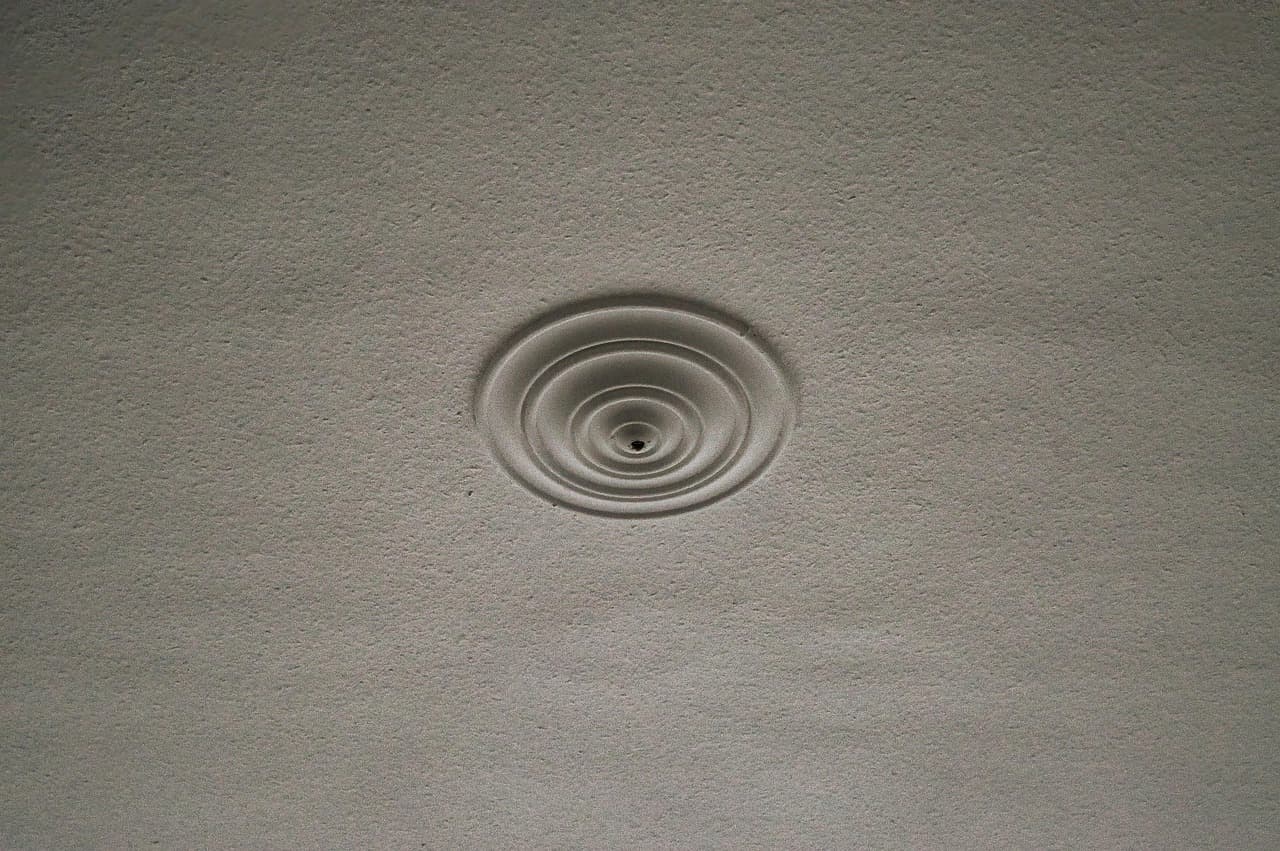 Ceiling rose set into a smooth plastered ceiling